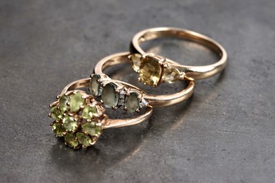Lot 194 - Three rings including: a peridot flower pattern cluster