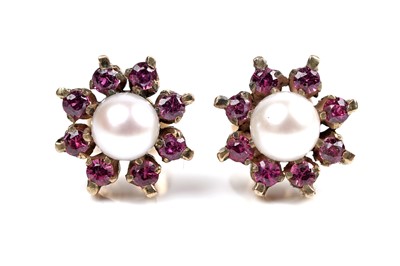 Lot 3 - A pair of ruby and pearl flowerhead pattern stud earrings
