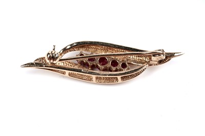 Lot 190 - A modern ruby and 9ct gold bar brooch