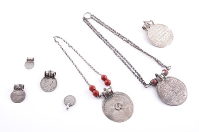 Lot 206 - Omani silver Maria Theresa and Rupee amulet necklaces