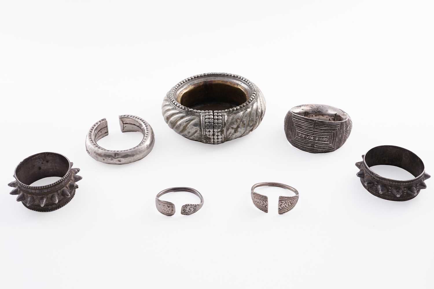 Lot 207 - Omani silver metal amulet bangles; and an anklet