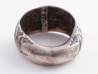 Lot 207 - Omani silver metal amulet bangles; and an anklet