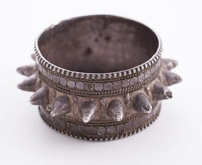 Lot 207 - Omani silver metal amulet bangles; and an anklet
