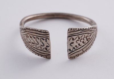 Lot 207 - Omani silver metal amulet bangles; and an anklet