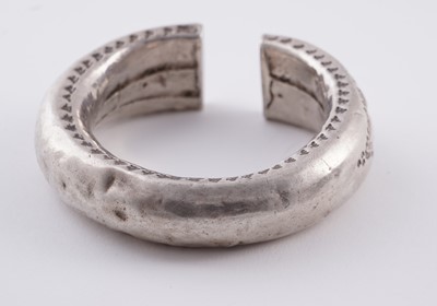 Lot 207 - Omani silver metal amulet bangles; and an anklet