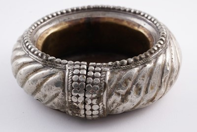 Lot 207 - Omani silver metal amulet bangles; and an anklet