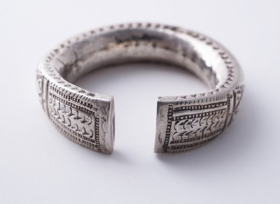 Lot 207 - Omani silver metal amulet bangles; and an anklet