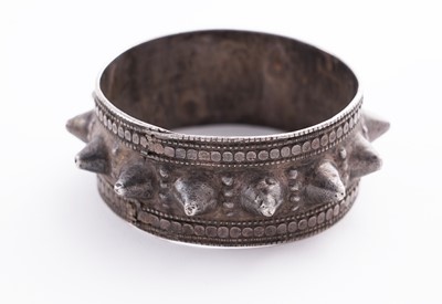 Lot 207 - Omani silver metal amulet bangles; and an anklet