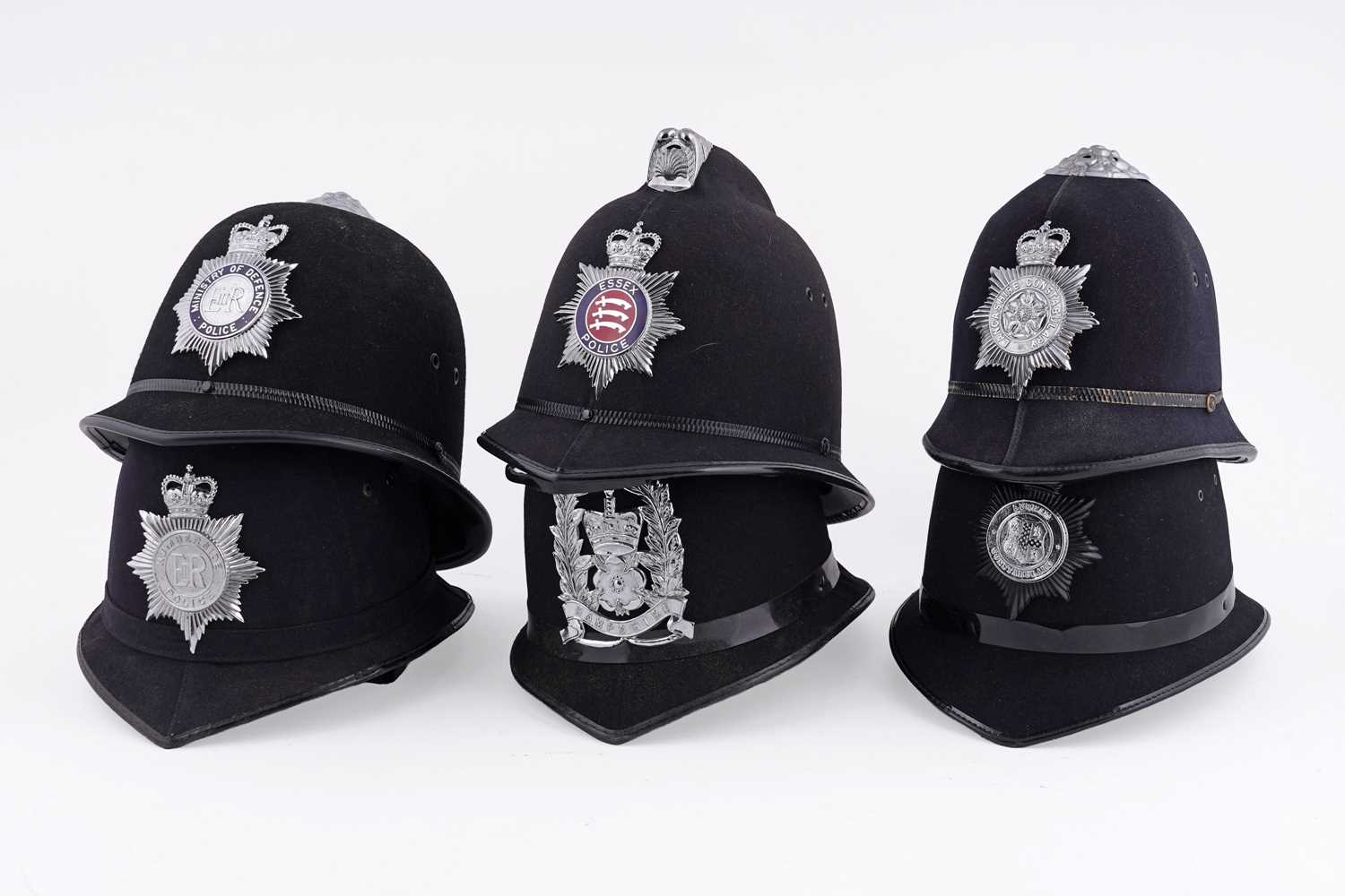 Lot 144 - A collection of six police helmets