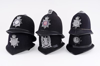 Lot 144 - A collection of six police helmets