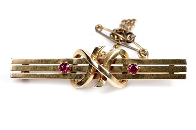 Lot 213 - A ruby and 15ct gold bar brooch
