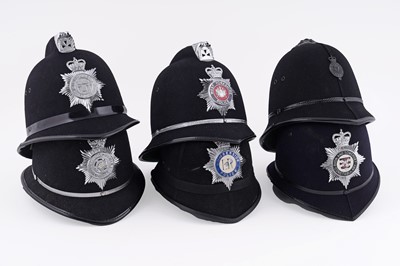 Lot 145 - A collection of six police helmets