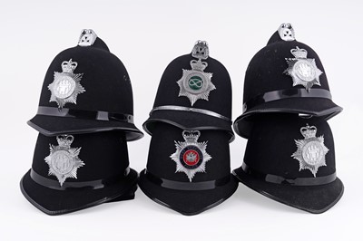 Lot 146 - A collection of six police helmets