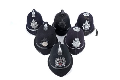 Lot 148 - A collection of six police helmets