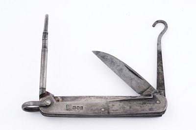 Lot 220 - An Edwardian silver-mounted steel multitool
