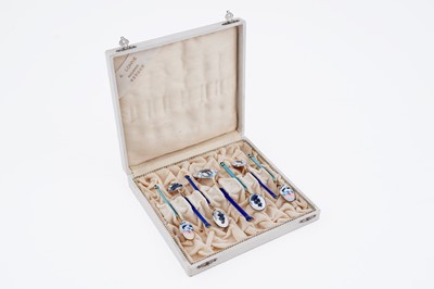 Lot 122 - A cased set of six Norwegian silver gilt and enamelled coffee spoons and matching sugar spoon