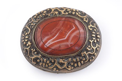 Lot 24 - A large brass buckle of domed oval form
