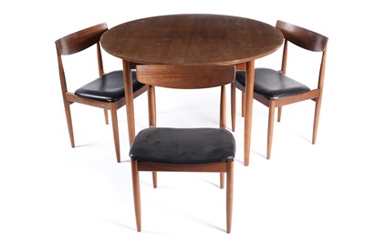 Lot 578 - Ib Kofod Larsen for G Plan: a set of three mid-20th Century teak dining chairs; and a teak table