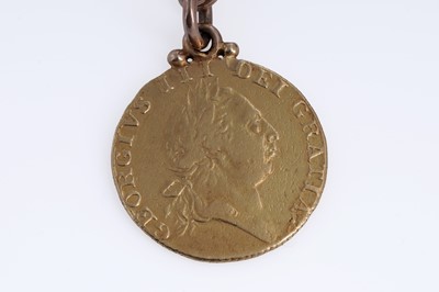 Lot 312 - A 9ct rose gold double "Albert" curb-link watch chain with a fob George III 1787 gold guinea