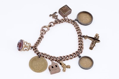 Lot 313 - A 9ct rose gold charm bracelet, with fob George III 1794 gold guinea, and sovereigns