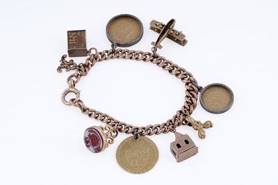 Lot 313 - A 9ct rose gold charm bracelet, with fob George III 1794 gold guinea, and sovereigns