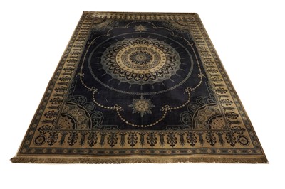 Lot 103 - A large Persian carpet