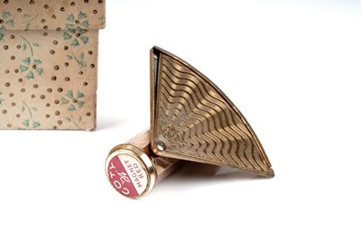Lot 214 - A 1950's Stratton for Coty novelty lipstick compact; and a 1950's perfume atomiser