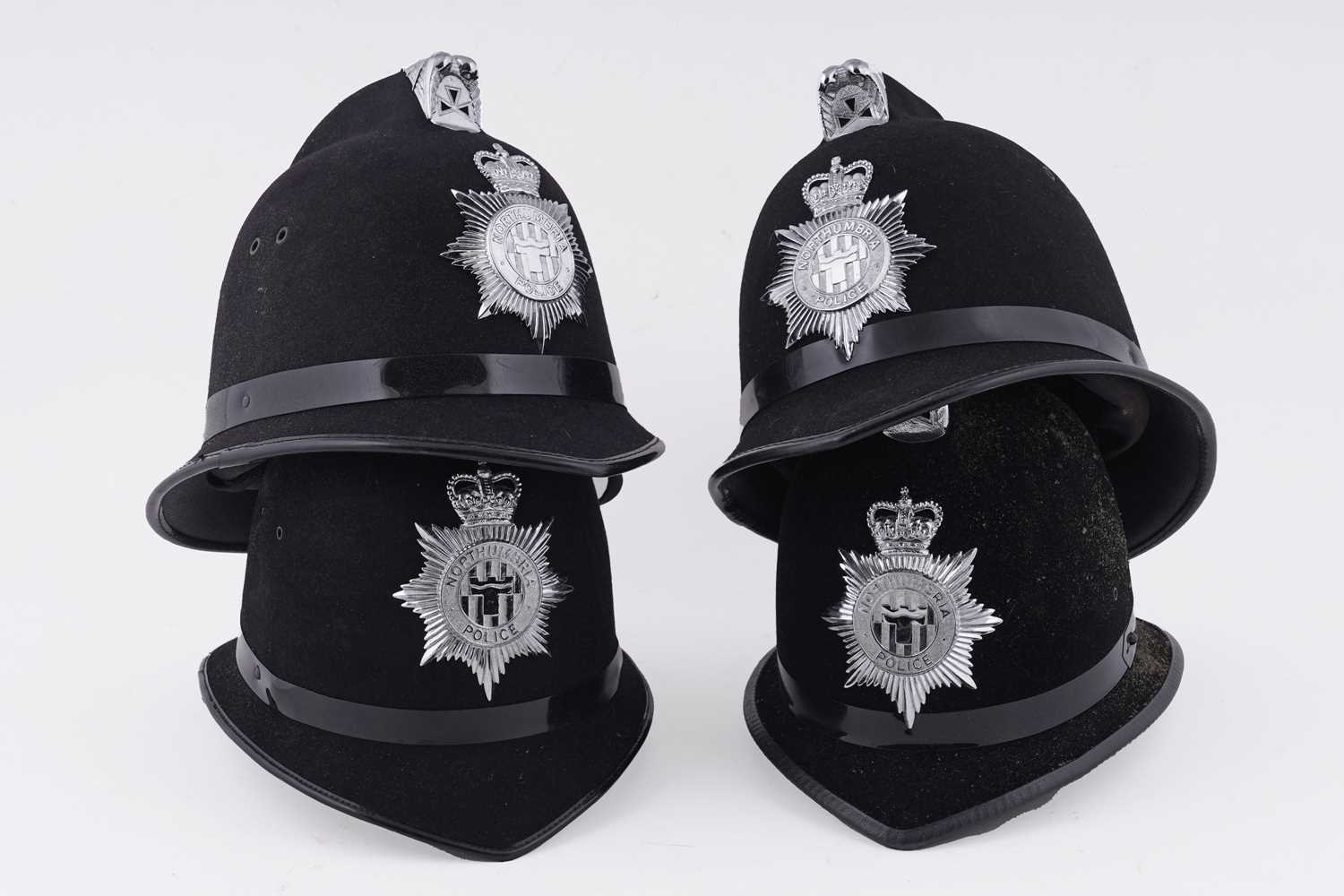 Lot 149 - A collection of four Northumbria Police helmets