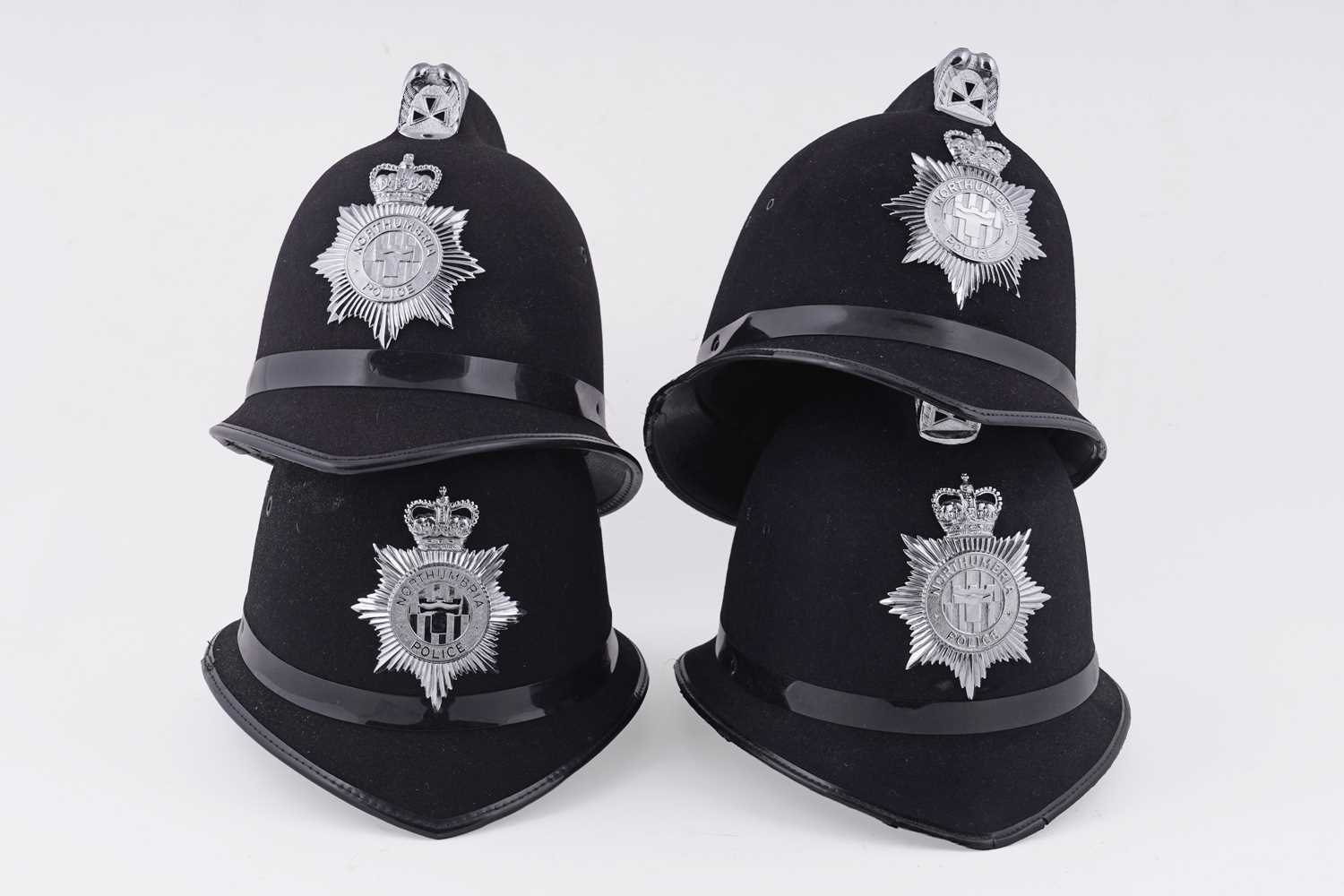 Lot 150 - A collection of four Northumbria Police helmets