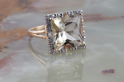 Lot 219 - Lorique: a golden beryl and diamond dress ring