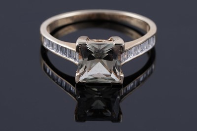 Lot 220 - A golden topaz and diamond ring