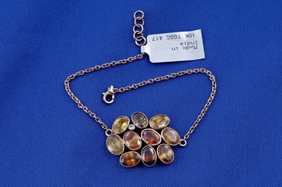 Lot 224 - A fire opal and diamond bracelet