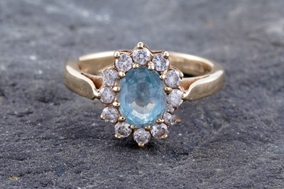 Lot 230 - An aquamarine and diamond cluster ring