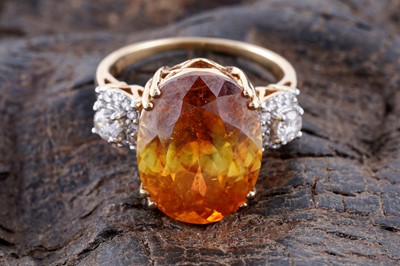 Lot 233 - Lorique: an orange stone and diamond ring