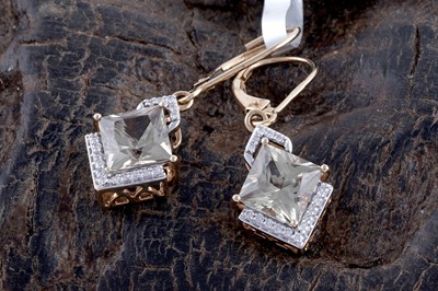 Lot 236 - A pair of sphene and diamond earrings