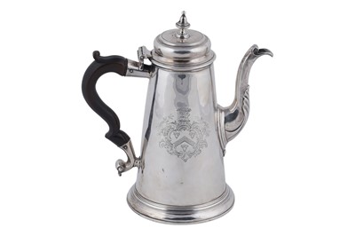 Lot 80 - A George II silver coffee pot of tapering form on a skirted base