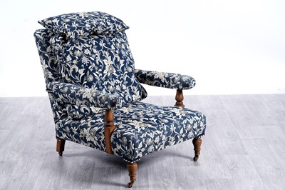 Lot 25 - An early 20th Century oak framed armchair