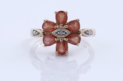 Lot 244 - A topaz and diamond dress ring