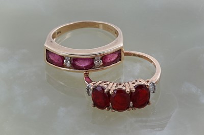 Lot 247 - Two ruby coloured stone and diamond rings