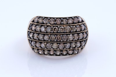 Lot 249 - A cinnamon-diamond bombe dress ring