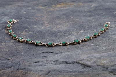 Lot 251 - An emerald and diamond bracelet