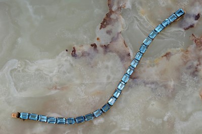 Lot 254 - A blue topaz line bracelet