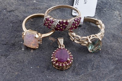 Lot 256 - A ruby and diamond ring, a ruby pendant and two other rings