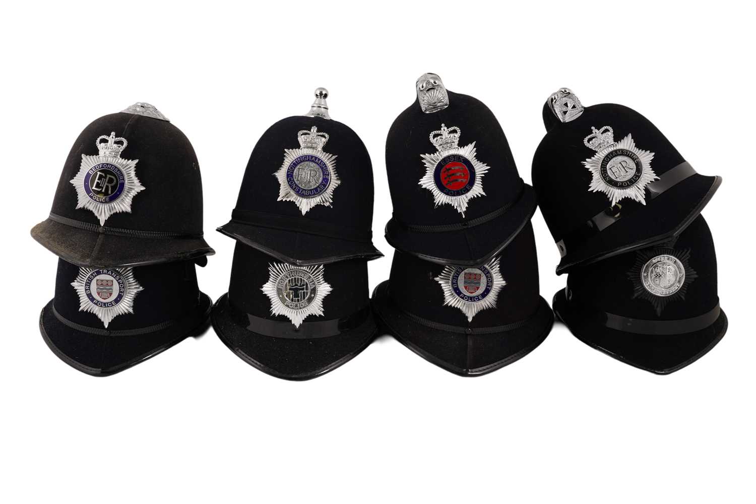 Lot 151 - A collection of eight police helmets