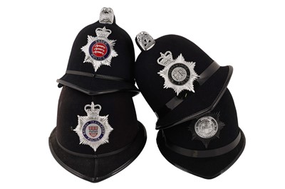 Lot 151 - A collection of eight police helmets