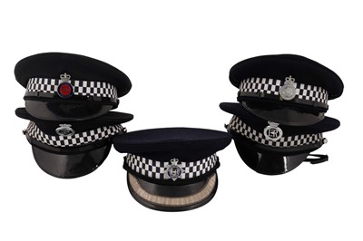 Lot 152 - A collection of five peaked police officers’ caps