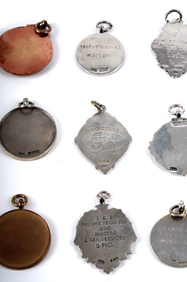 Lot 37 - A collection of silver, gold and silver plated medals, fobs and badges