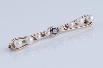 Lot 7 - A 1930's bow-pattern sapphire and pearl bar brooch