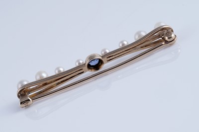 Lot 7 - A 1930's bow-pattern sapphire and pearl bar brooch