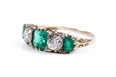 Lot 893 - A Colombian emerald and diamond ring